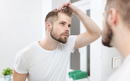 Man wondering how to shave head with a razor